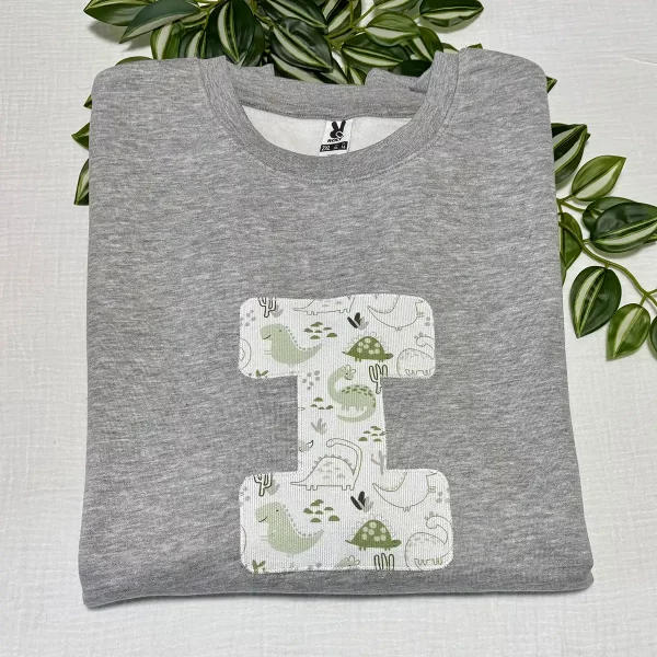 sudadera-adulto-personalizada-inicial-dinosaurios