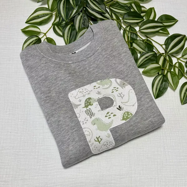 sudadera-infantil-personalizada-inicial-dinosaurios